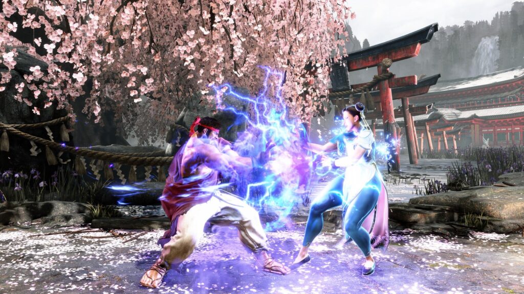 Ryu e Chun-Li trocam golpes cercados de raios roxos sob uma cerejeira em flor, em captura oficial de Street Fighter 6