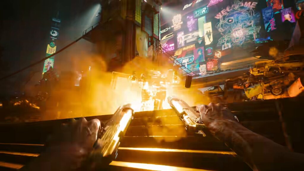 Visão em primeira pessoa de V atirando com uma pistola dourada em cada mão, entre clarões de tiros, diante de um paredão de letreiros de neon, em cena do vídeo oficial da atualização 2.5 de Cyberpunk 2077