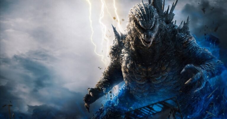 Godzilla, com o corpo coberto de energia azul, avança entre raios sob um céu de tempestade na arte oficial de Godzilla Minus Zero