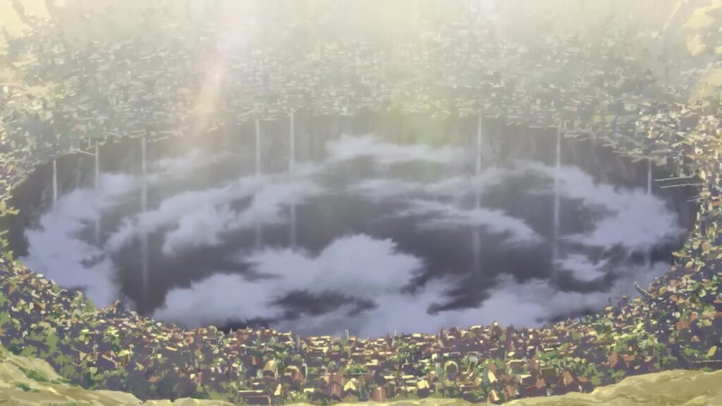 A boca do Abismo vista de cima, uma cratera gigante cercada de mata e coberta por nuvens, em quadro do teaser oficial do filme