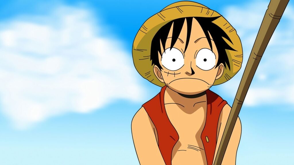 Luffy, de chapéu de palha e colete vermelho, olha surpreso diante de um céu azul na arte oficial do Anime One Piece